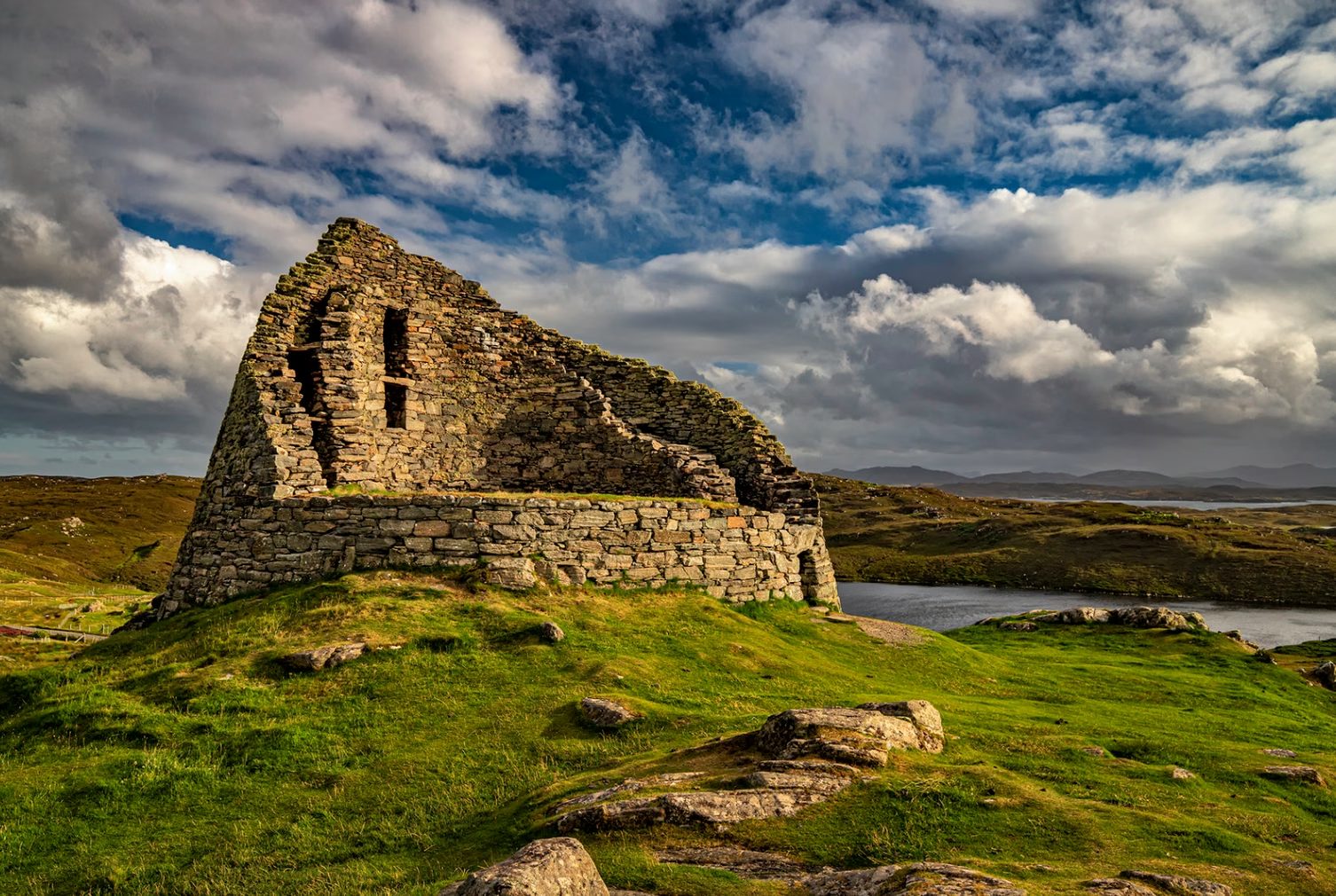 Dun Carloway broch against a moody sky