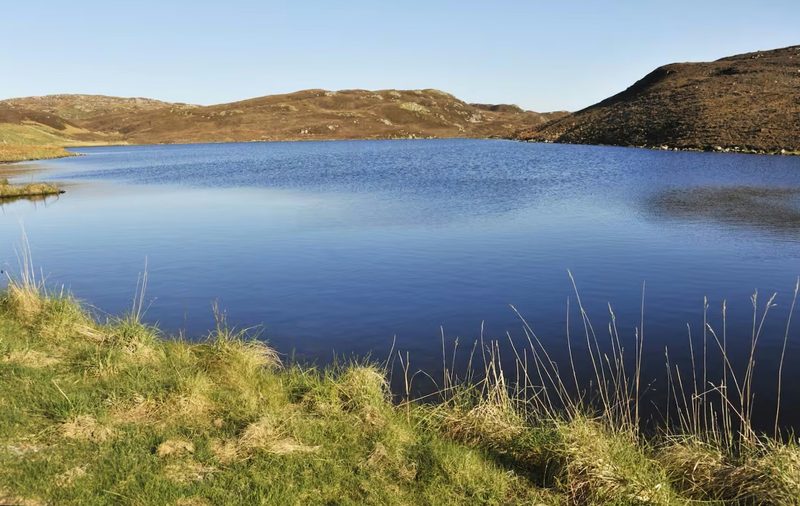 A still loch on the west side of Lewis