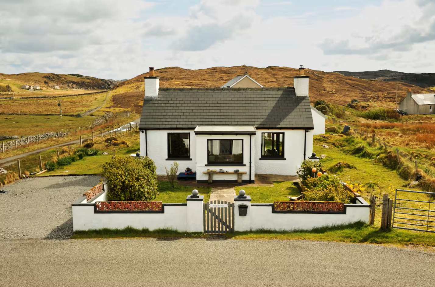 Stone cottage beneath the mountains